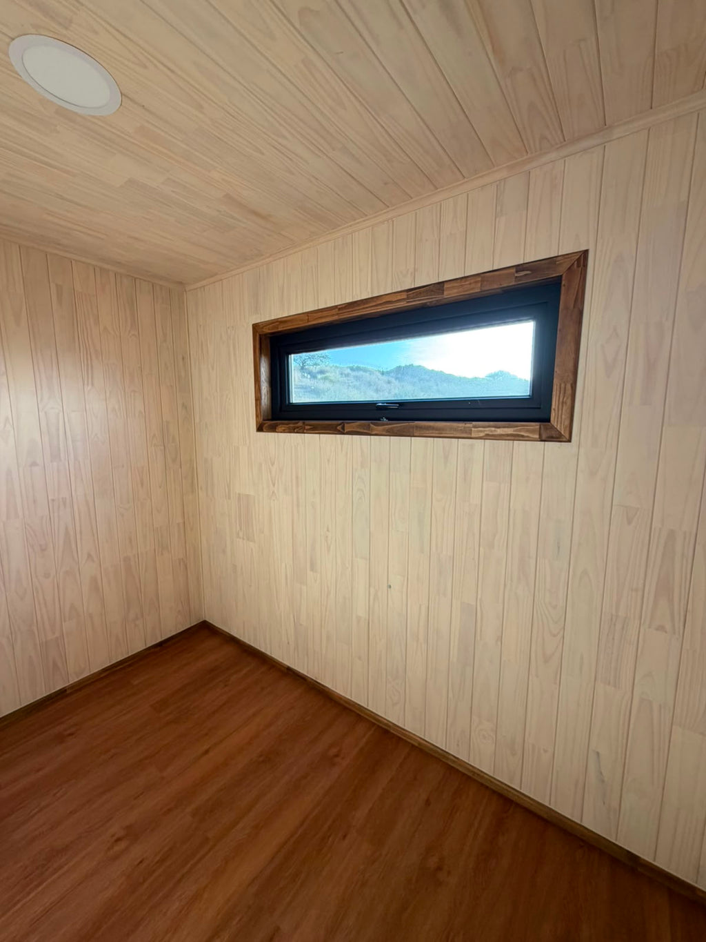 Dormitorio ventana panorámica