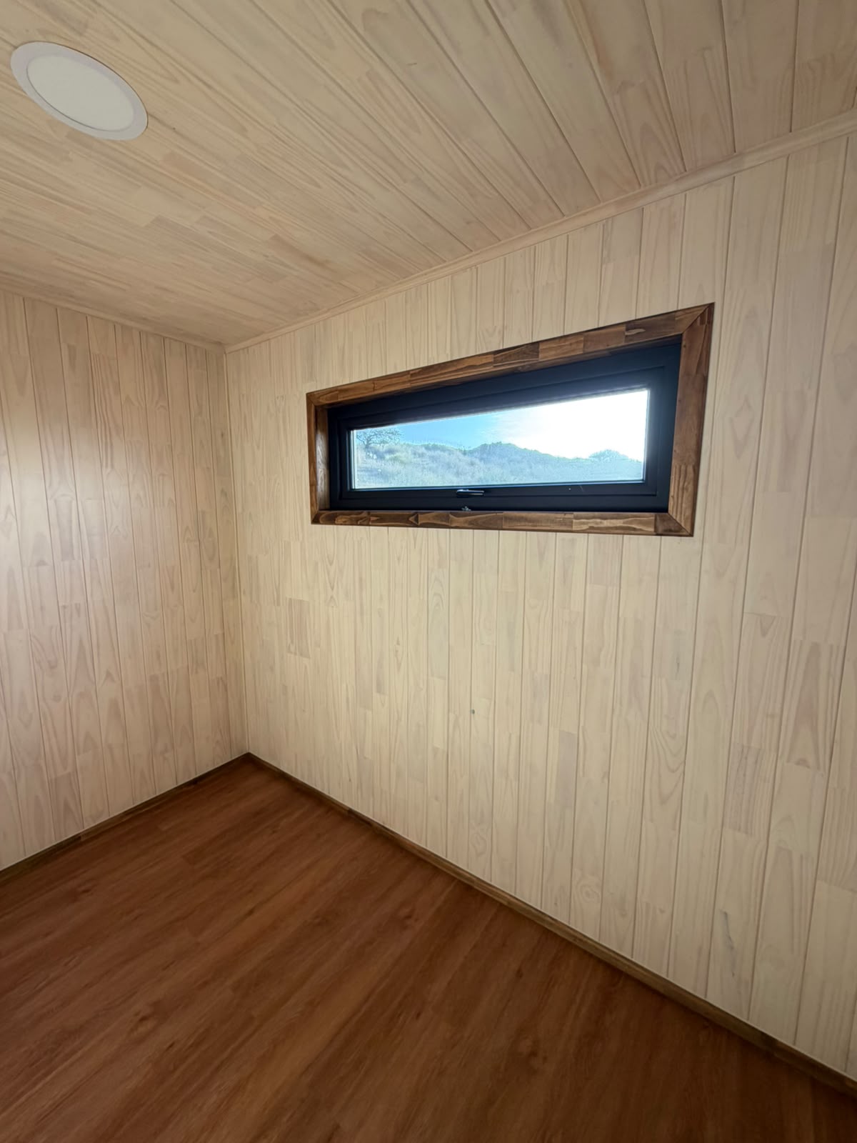 Dormitorio ventana panorámica